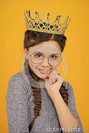 Adorable girl in glasses. Happy smiling princess. Excellent pupil. Success and happiness. Smartest princess. Intelligent Stock Photo
