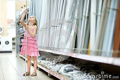 Adorable girl in a houseware store Stock Photo