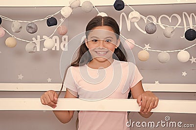 Adorable girly kid. Happy girl in night nursery. Cute look of small girl. Little girl feel comfy at home. Innocent Stock Photo