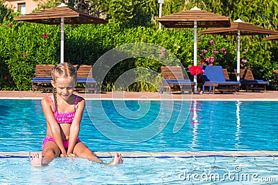 Adorable happy little girl enjoy swimming in the Stock Photo