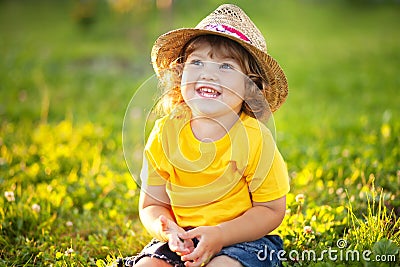 Adorable happy todder girl with staw hat, little farmer Stock Photo