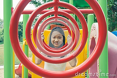 Adorable and Holiday Concept : Cute little child feeling funny and happiness on playground. Stock Photo