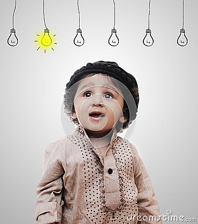 Adorable Intelligent Little Boy Thinking - Idea Bulbs Stock Photo