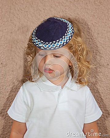 Adorable Jewish child in a blue skullcap Stock Photo