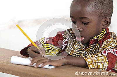 Adorable Little African Child Writing at School in Bamako, Mali Stock Photo