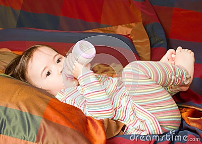 Adorable little baby girl with bottle Stock Photo