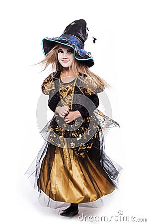 Adorable little blond girl wearing a witch costume smiling at the camera. Halloween. Fairy. Tale. Studio portrait isolated Stock Photo