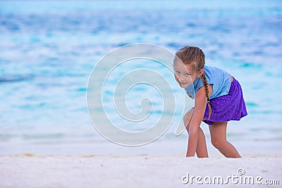 Adorable little girl at beach during summer Stock Photo