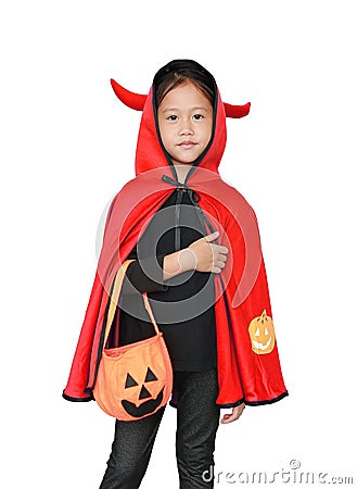 Adorable little girl dressed Halloween costume. Kid in Dracula robe isolated on white background Stock Photo