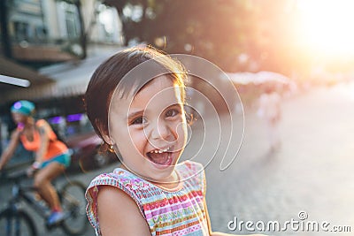 Adorable little girl having fun in a city Stock Photo