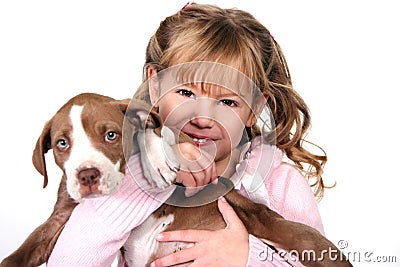 Adorable Little Girl Holding Her Puppy Stock Photo