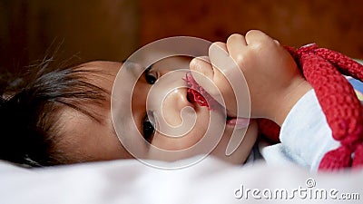 Adorable Little Girl Lying on Bed with Sucking Her Thumb in Bedroom. Stock Footage - Video of asian, exercise: 175358354 