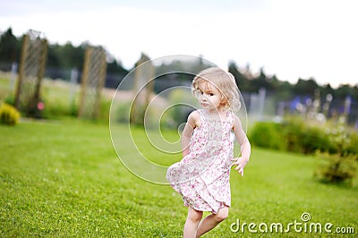 Adorable little girl in a meadow Stock Photo