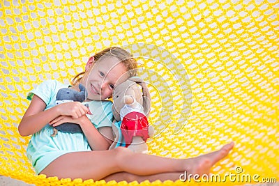 Adorable little girl relaxing in hammock Stock Photo