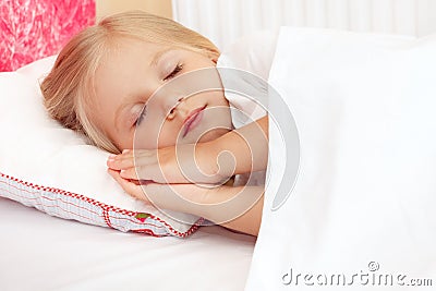 Adorable little girl sleeping in the bed Stock Photo