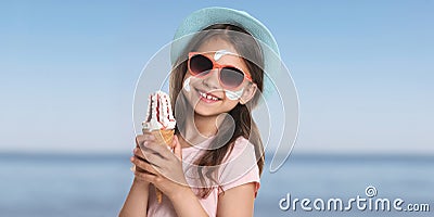 Adorable girl with sun protection cream on face at beach, banner design Stock Photo