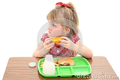 Adorable Little Girl Unhappy with School Lunch Stock Photo