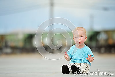 Adorable one year old boy train tracks Stock Photo