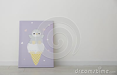 Adorable picture of penguin and ice cream on floor near wall, space for text. Children`s room interior element Stock Photo