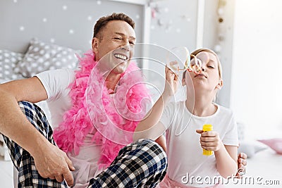 Adorable positive family having a time of their lives Stock Photo