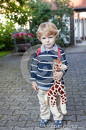 Adorable preschooler on way to school kindergarten summer Stock Photo