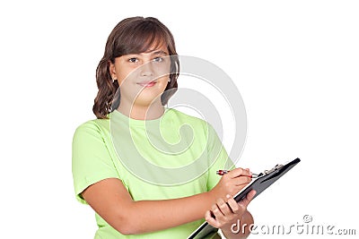 Adorable preteen girl writing on clipboard Stock Photo