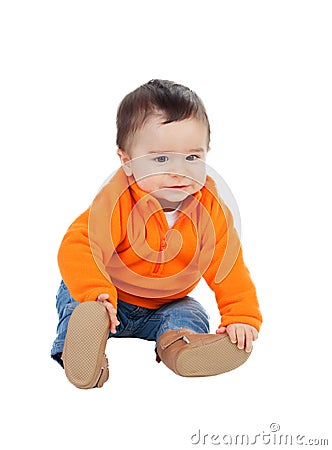 Adorable six month baby with orange jersey Stock Photo