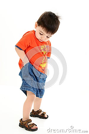 Adorable Toddler Boy Checking Pockets for Money Stock Photo