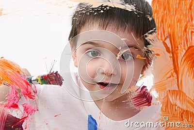 Adorable Toddler Boy Painting On Glass Stock Photo