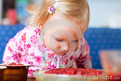 Adorable toddler with strawberry pie Stock Photo