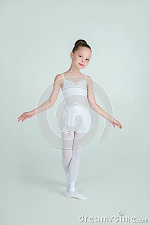 Adorable young ballerina poses on camera Stock Photo