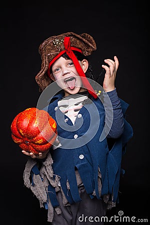 Adorable young boy dressed in a pirate outfit, playing trick or treat for Halloween Stock Photo