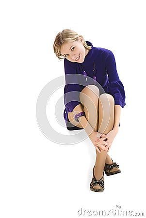 Adorable young woman sitting on the floor Stock Photo