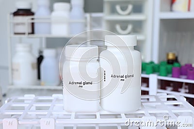 Adrenal gland pill in white bottle, pill stock Stock Photo