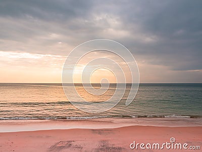 Adstract color of pink beach in golden sunset at the beach. dramatic gray cloudy sky above sea water Stock Photo