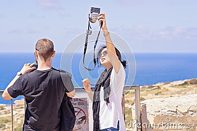 Adult asian couple people take selfie using mobile phone outdoor Editorial Stock Photo