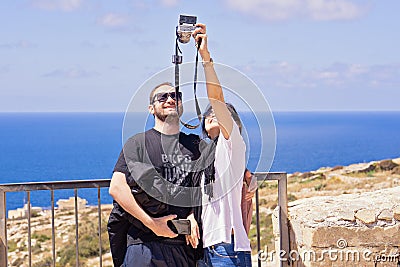 Adult asian couple people take selfie using mobile phone outdoor Editorial Stock Photo