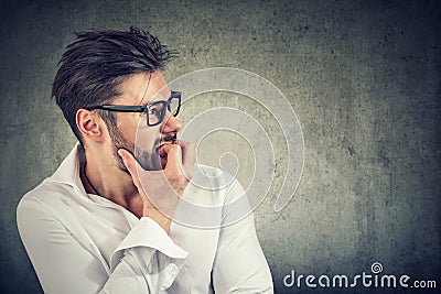 Anxious man with phobia biting nails Stock Photo