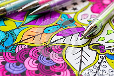 Adult coloring book, new stress relieving trend. Art therapy, mental health, creativity and mindfulness concept. Adult coloring. Stock Photo