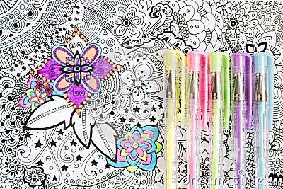 Adult coloring book, new stress relieving trend. Art therapy, mental health, creativity and mindfulness concept. Stock Photo