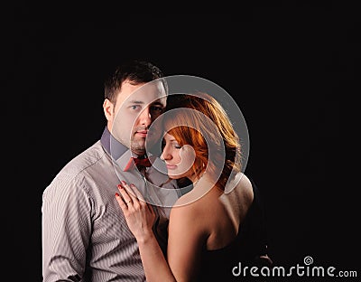 adult couple standing. Studio picture on the black background Stock Photo