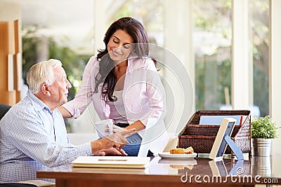 Adult Daughter Helping Father With Laptop Stock Photo