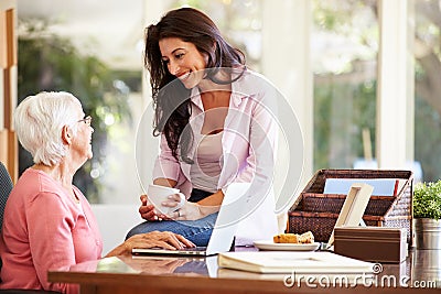 Adult Daughter Helping Mother With Laptop Stock Photo