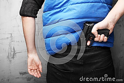 Adult European man with black pistol. Carrying weapons with you. Sense of security Stock Photo