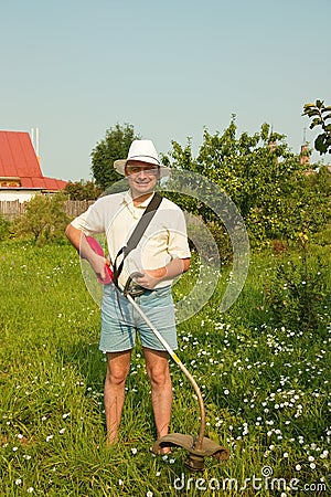 Adult gardener working in the yard Stock Photo