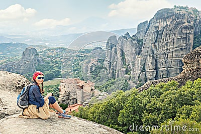 Adult happy woman traveler enjoys landscape with volcanic mount Stock Photo