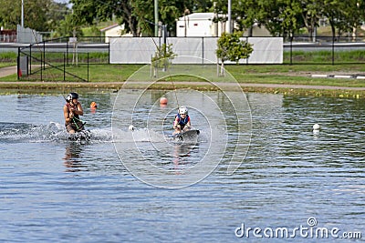 Adult Helps Child To Kneeboard Editorial Stock Photo