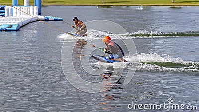 Adult Helps Child To Kneeboard Editorial Stock Photo