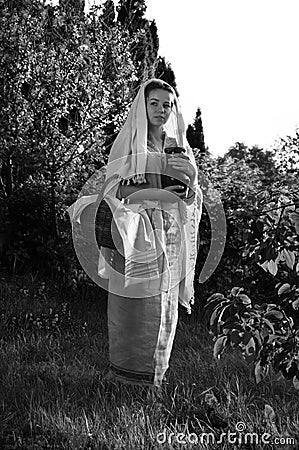 Young slave woman in the garden Stock Photo