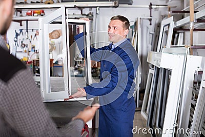 Adult labour demonstrating PVC profiles Stock Photo